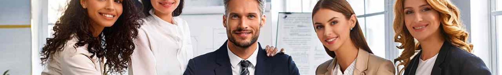 Accounting-Team-of-men-and-women-at-work-posing-for-a-photo-in-office